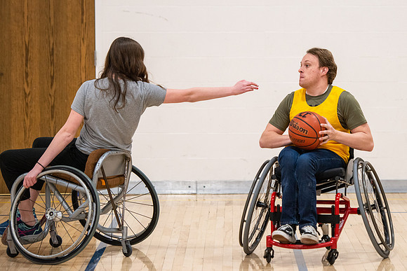 Students participate of Wheelchair Basketball in the Hart Gym.