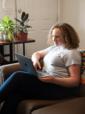 BYUI student Hannah Cobbley watches Sister Kelly and President Henry J. Eyring's devotional in her apartment at the start of the fall 2021 semester.
