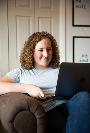 BYUI student Hannah Cobbley watches Sister Kelly and President Henry J. Eyring's devotional in her apartment at the start of the fall 2021 semester.