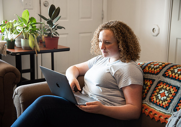 BYUI student Hannah Cobbley watches Sister Kelly and President Henry J. Eyring's devotional in her apartment at the start of the fall 2021 semester.