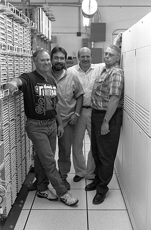 Employees check new switchboard telephone system.