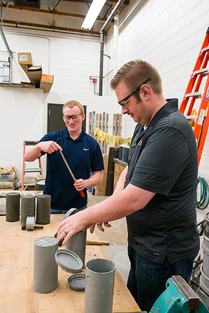 Civil engineering students work with different mixtures of cement to make a light, yet durable, cement that will be the building material for a canoe.