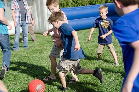 Online instructors gather with their families for an eveing of BBQ and games.