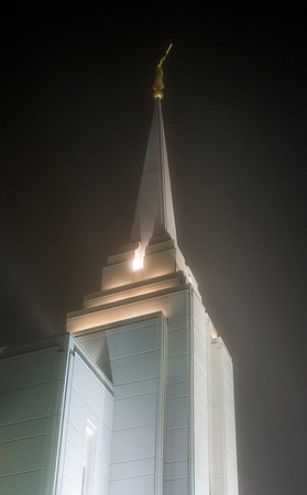 Rexburg Temple lights cut through the fog on a cold winter night.