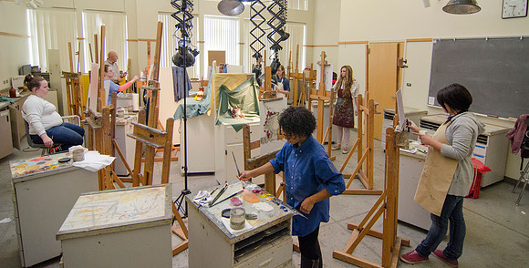 David Belka enthusiatically teaches painting principles to beginning painting class.