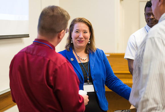 Faculty gather in the Hinckley Building for a conference to learn from their peers. Instructor Kristina Otinel