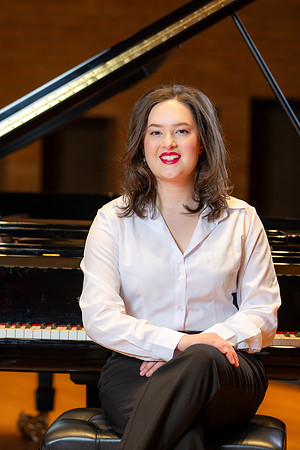 Music major, Kaitlynd Ruesch at the grand piano preparing for here senior recital in the Barrus Concert Hall.