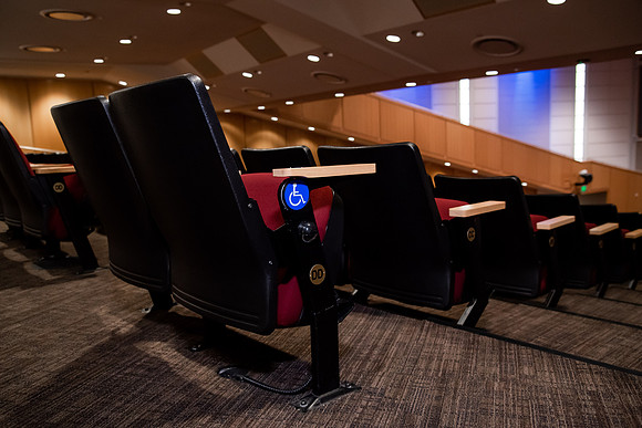 Ushers perform their duties in the I-Center to prepare for devotional. Used for an usher training video.