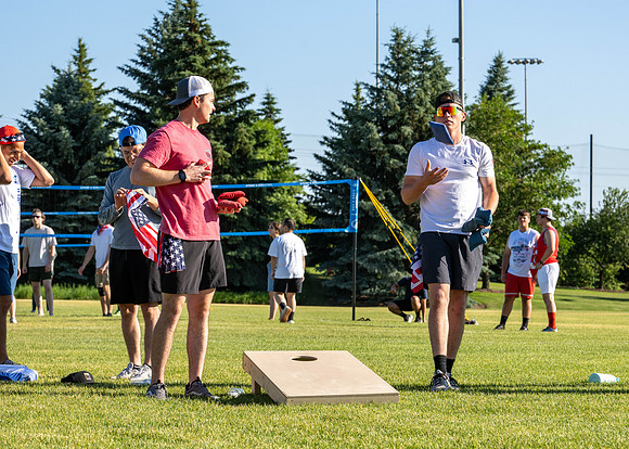 Students gather at the upper field for various 4th of July activities.