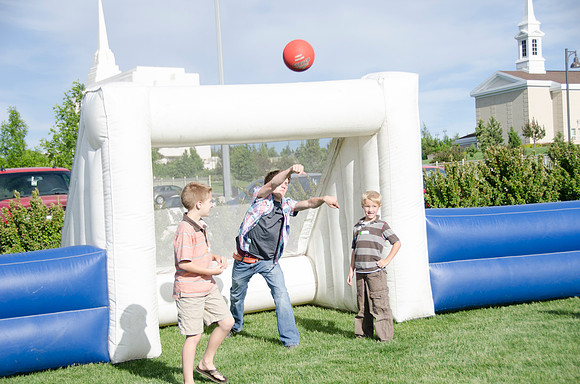 Online instructors gather with their families for an eveing of BBQ and games.