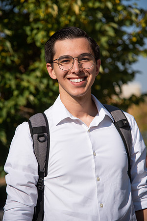 Student smiling on campus.