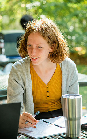 Students studying in the Ricks gardens.