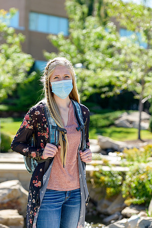 Student volunteers show the way to stay safe during this COVID 19 pandemic by social distancing, following pathway arrows and proper wearing of masks .