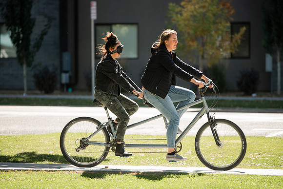 A BYUI therapeutic recreation class rides adaptive bicycles in Porter park during the fall 2021 semester.