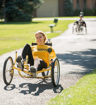 A BYUI therapeutic recreation class rides adaptive bicycles in Porter park during the fall 2021 semester.