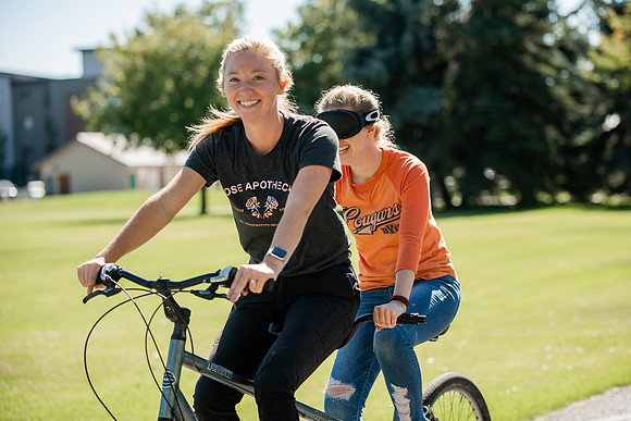 A BYUI therapeutic recreation class rides adaptive bicycles in Porter park during the fall 2021 semester.