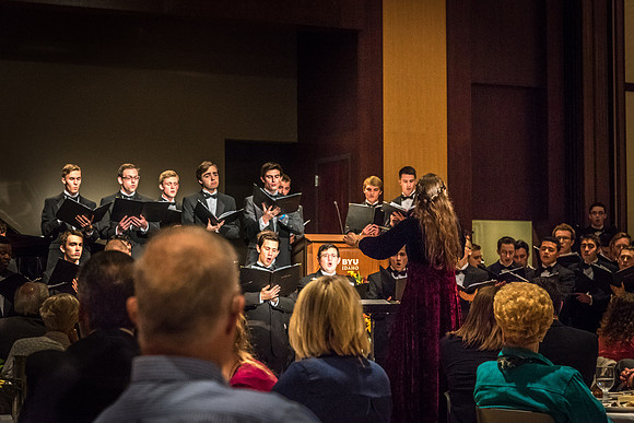 A choir performs a special musical number at the banquet.