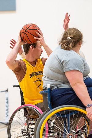 Students participate of Wheelchair Basketball in the Hart Gym.