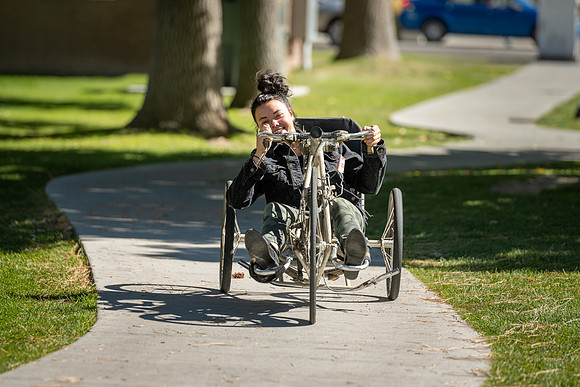 Students in Keith Barney's Adaptive Recreation class get the opportunity to ride hand pedal tricycles at Porter Park.