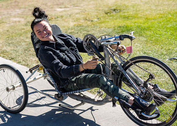 Students in Keith Barney's Adaptive Recreation class get the opportunity to ride hand pedal tricycles at Porter Park.