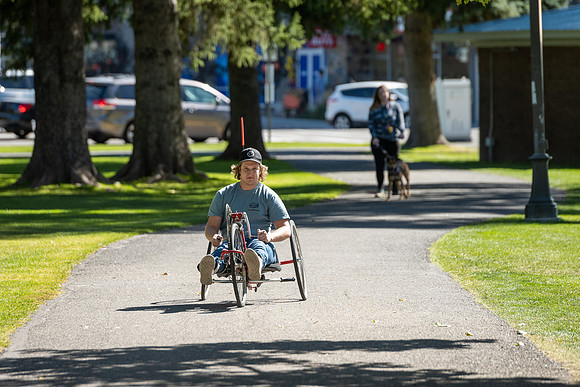 Students in Keith Barney's Adaptive Recreation class get the opportunity to ride hand pedal tricycles at Porter Park.