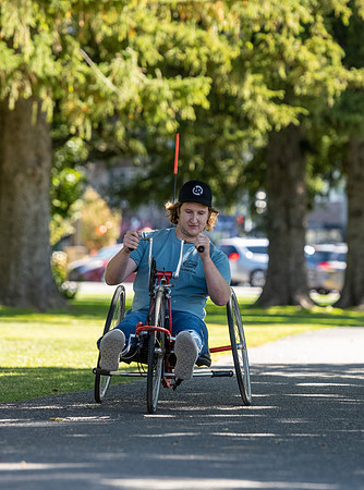 Students in Keith Barney's Adaptive Recreation class get the opportunity to ride hand pedal tricycles at Porter Park.
