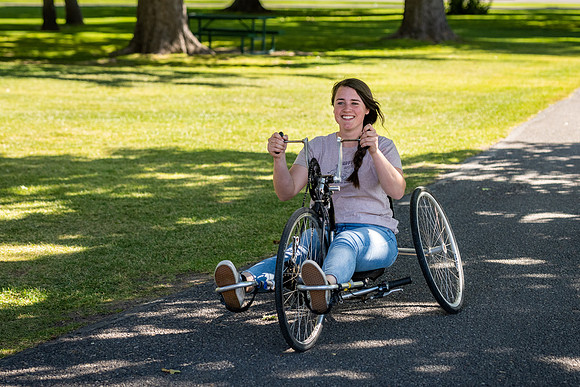 Students in Keith Barney's Adaptive Recreation class get the opportunity to ride hand pedal tricycles at Porter Park.