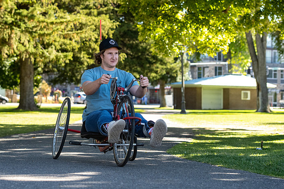 Students in Keith Barney's Adaptive Recreation class get the opportunity to ride hand pedal tricycles at Porter Park.