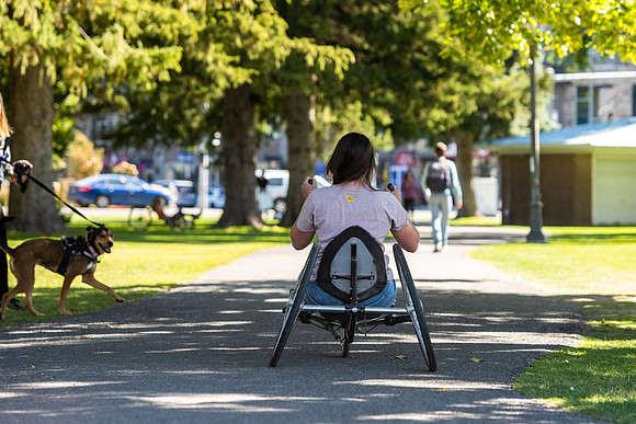 Students in Keith Barney's Adaptive Recreation class get the opportunity to ride hand pedal tricycles at Porter Park.