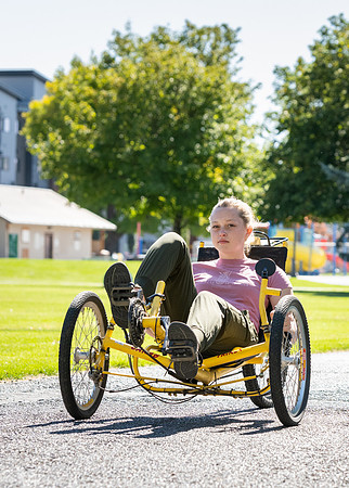 Students in Keith Barney's Adaptive Recreation class get the opportunity to ride hand pedal tricycles at Porter Park.