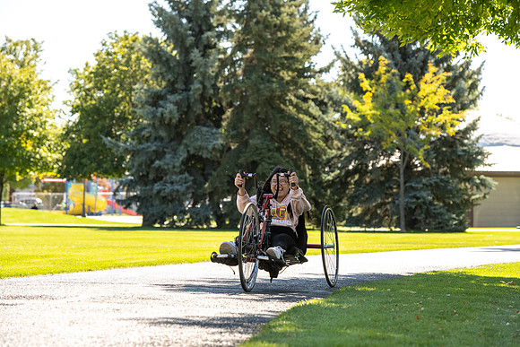 Students in Keith Barney's Adaptive Recreation class get the opportunity to ride hand pedal tricycles at Porter Park.