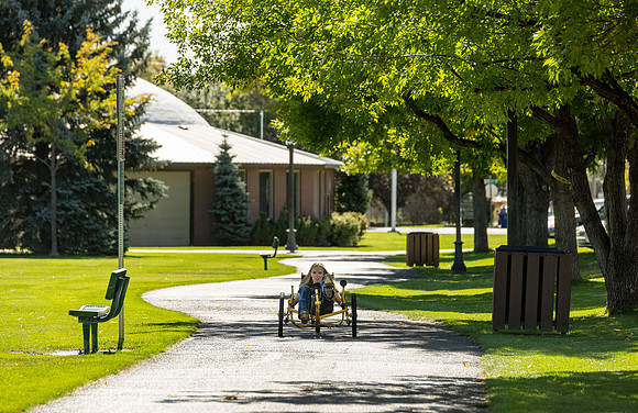 Students in Keith Barney's Adaptive Recreation class get the opportunity to ride hand pedal tricycles at Porter Park.