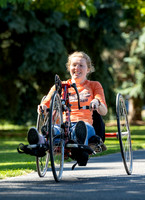 Students in Keith Barney's Adaptive Recreation class get the opportunity to ride hand pedal tricycles at Porter Park.