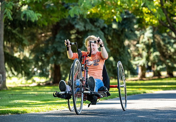 Students in Keith Barney's Adaptive Recreation class get the opportunity to ride hand pedal tricycles at Porter Park.