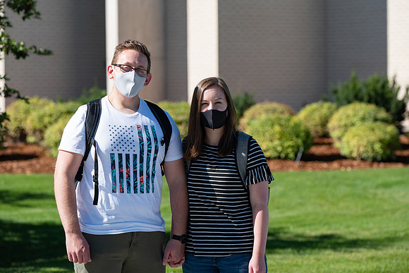 Examples of students staying safe and healthy during the COVID-19 pandemic by social distancing, following pathway arrows, and wearing face masks.