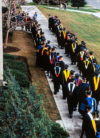 Graduates march into the Hart building during the processional.