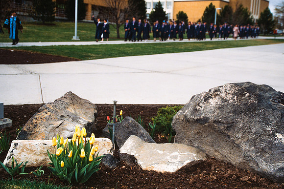 Graduates march into the Hart building during the processional.