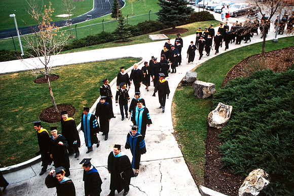 Graduates march into the Hart building during the processional.