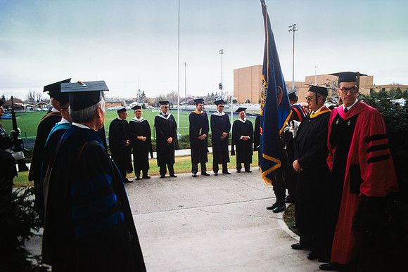 Graduates march into the Hart building during the processional.