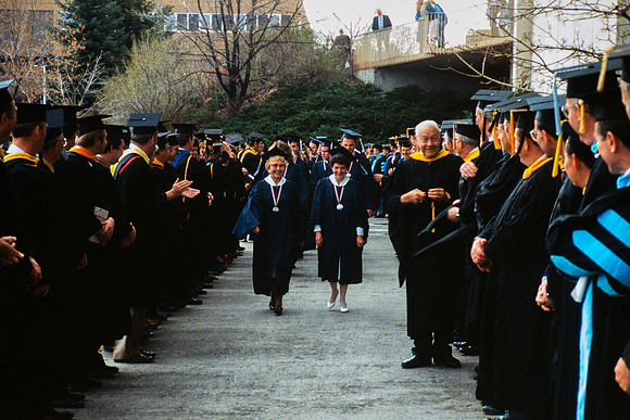 Graduates march into the Hart building during the processional.