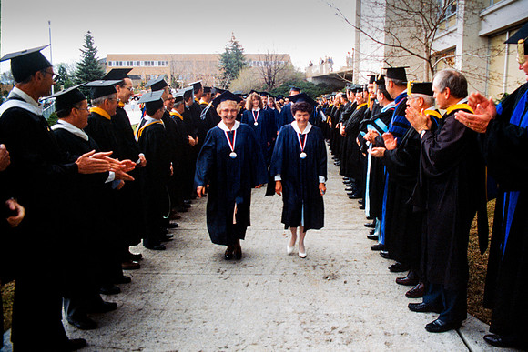 Graduates march into the Hart building during the processional.