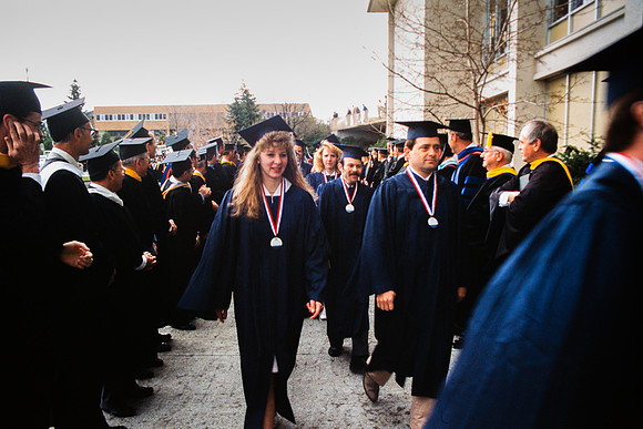 Graduates march into the Hart building during the processional.