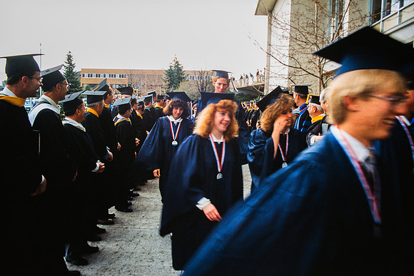 Graduates march into the Hart building during the processional.