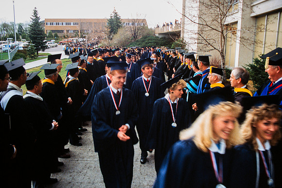 Graduates march into the Hart building during the processional.