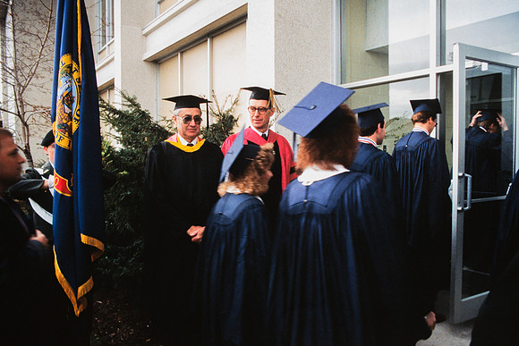 Graduates march into the Hart building during the processional.