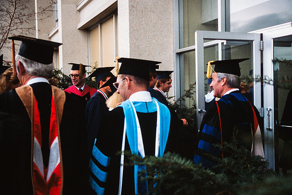 Graduates march into the Hart building during the processional.