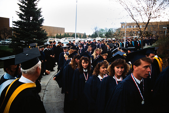 Graduates march into the Hart building during the processional.