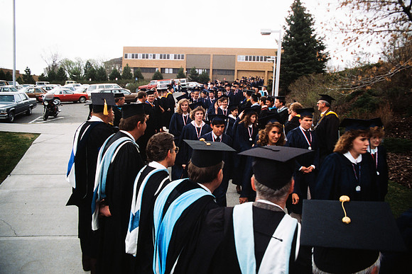 Graduates march into the Hart building during the processional.