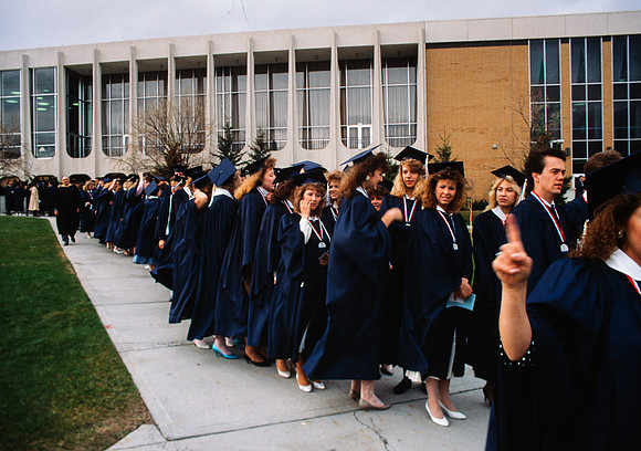 Graduates march into the Hart building during the processional.
