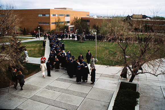 Graduates march into the Hart building during the processional.